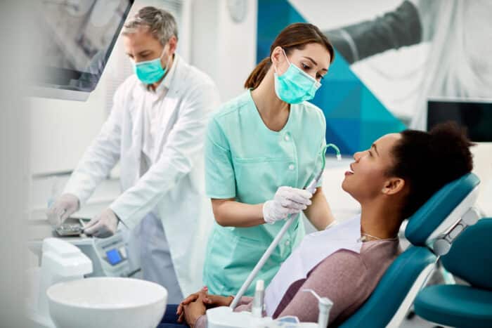 a woman getting dental treatment.